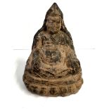 An early Chinese red clay figure of a seated yello