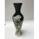 A moorcroft vase decorated in the Trefoil pattern