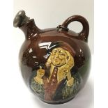 A royal Doulton glazed jug with stopper.