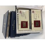 7 albums of 22ct gold replica British stamp first day covers.