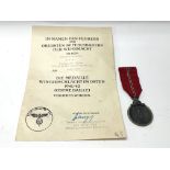 A WW2 German Eastern front medal with award certif