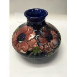 A early Moorcroft vase decorated with flowers and