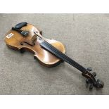 An unmarked students violin. Button to back measuring 36cm