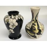 Two small Moorcroft bud vases, one decorated with