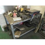 A solid steel mechanic work bench with attached vi