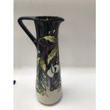 A moorcroft jug decorated in the swing time patter