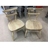 A pair of small stackable Ercol chairs