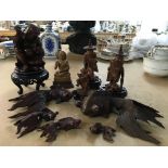 A collection of carved oriental figures including