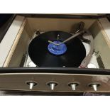 A 1950s Pye record player in mahogany case.