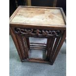 A nest of three Chinese occasional tables .