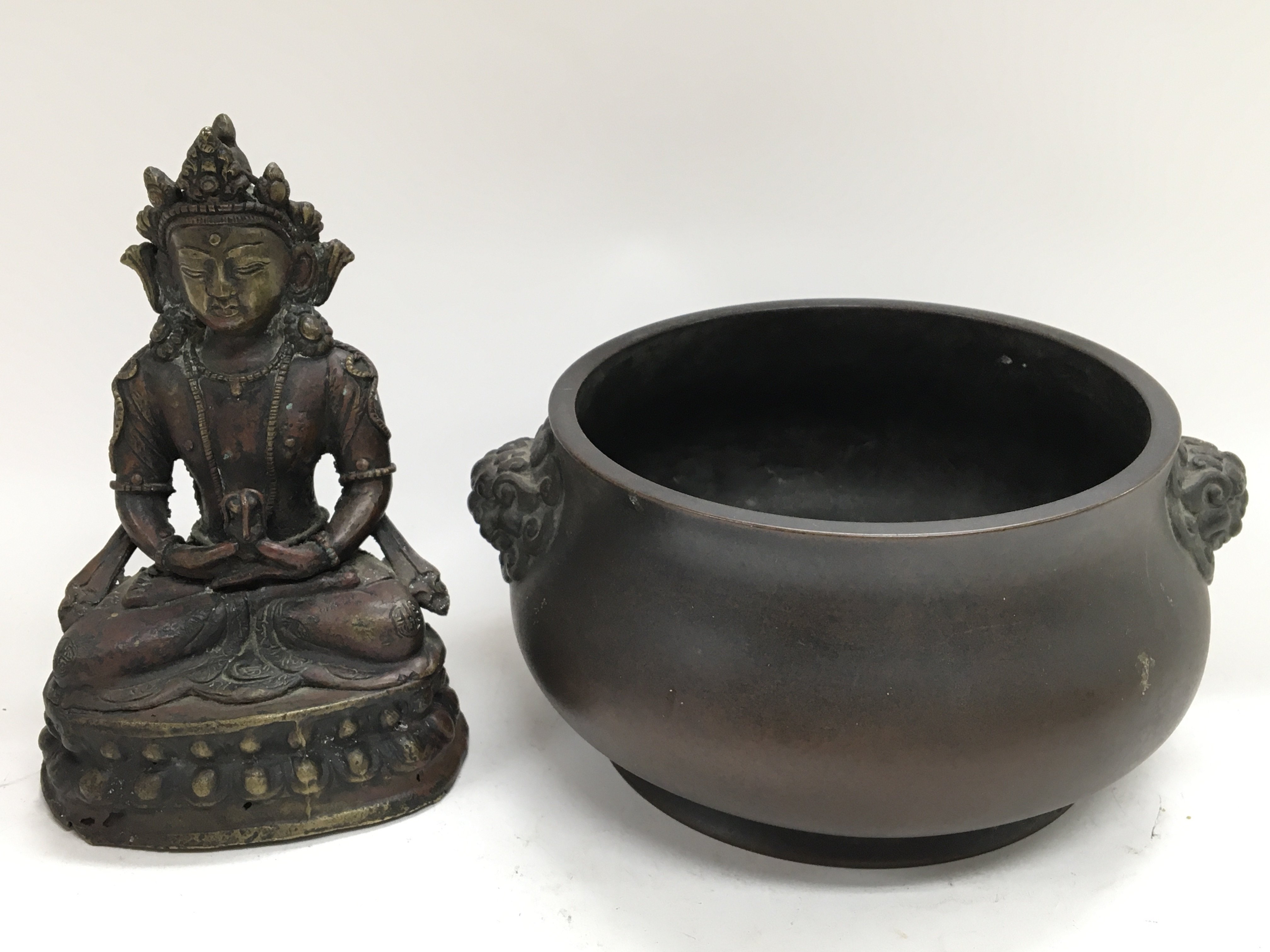 A Chinese bronze bowl with lion mask handles and m