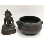 A Chinese bronze bowl with lion mask handles and m