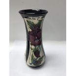 A moorcroft vase decorated in the glory and dreams