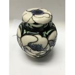 A small Moorcroft ginger jar and cover decorated w
