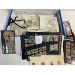 A box of Spanish stamps mounted and unmounted.