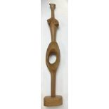 A modern wooden sculpture of a female silhouette, unsigned and unattributed. Measuring in height