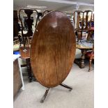 A mahogany tilt topped oval breakfast table - NO R