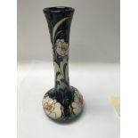 A moorcroft vase decorated in the Rose Alba patter