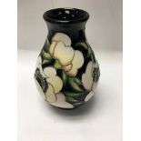 A small Moorcroft vase decorated in the Anemone bl