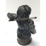 An unusual black figure of a violinist sat on a br