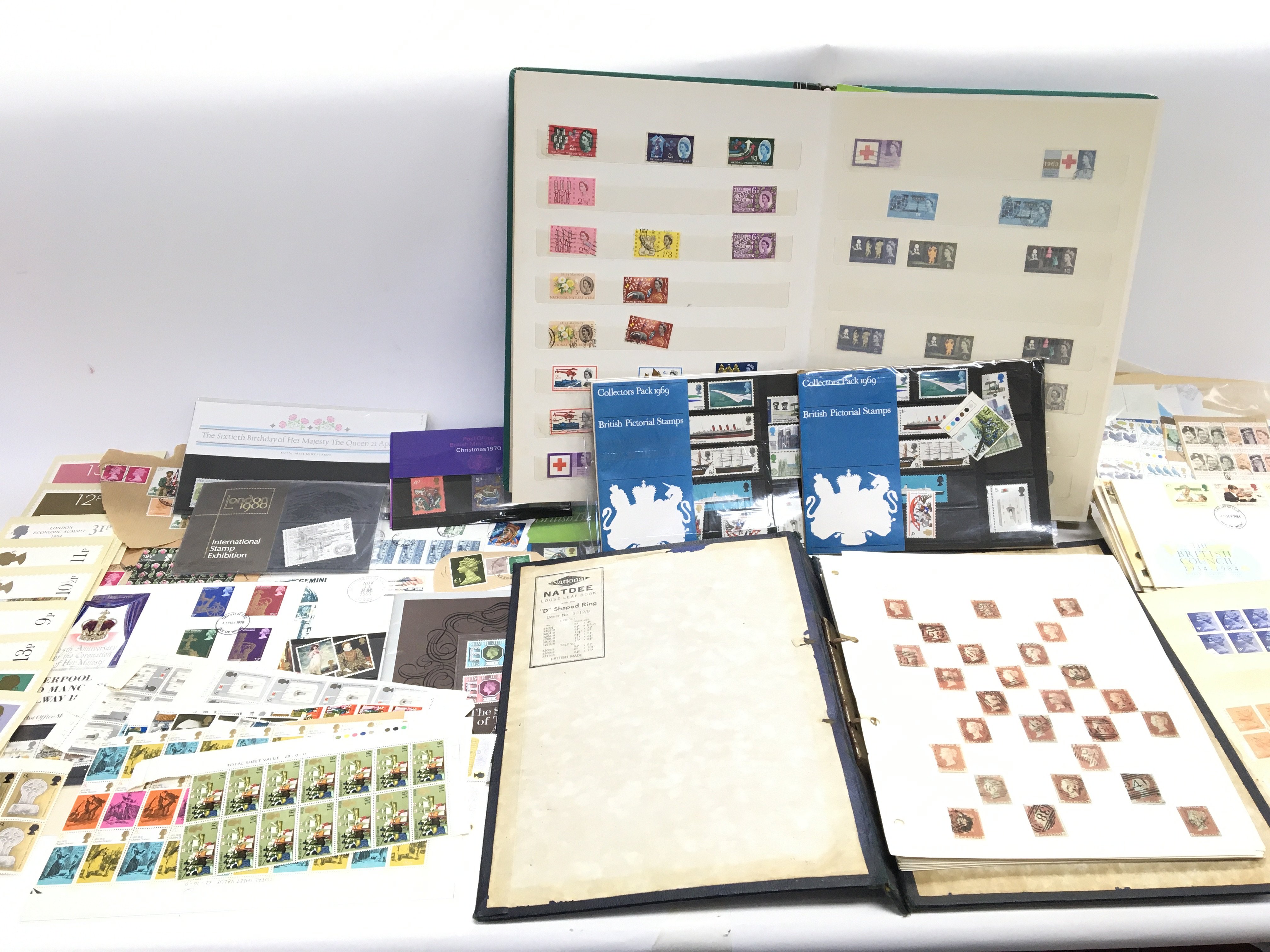 A collection of various stamps including a number of penny reds and British pictorial stamps.