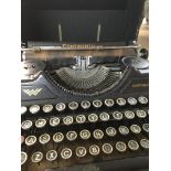 A continental Type writer with fitted case .