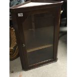 A Mahogany hanging cabinet with a glazed door - NO