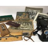 Two pairs of binoculars slide rules a draftsmen set Vintage Football photos Shepherdswell Football