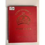 A King George red stamp album with mint and used stamps.