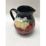 A moorcroft jug decorated in the Forever England p