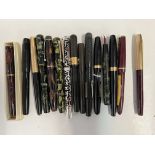 A collection of vintage fountain pens including Pa