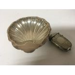 A silver shell shaped dish and a silver plated Ves