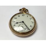 A gold plated pocket watch.