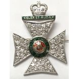 A pin badge modelled in the form of the cap badge