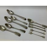 A collection of silver spoons and small forks incl