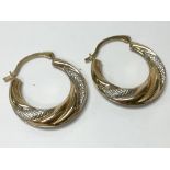 A pair of 9ct gold hoop earrings.