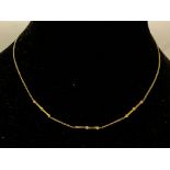 An 9ct gold small link chain necklace weighing app