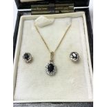 9ct gold stud earrings and matching pendant set wi