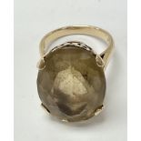 A 9ct gold ring set with a large quartz. The appro