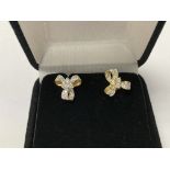 18ct gold stud earrings In the shape of ribbon tie