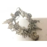 A silver charm bracelet weight 66g