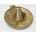 A 9ct gold charm in the form of a sombrero. Weighi