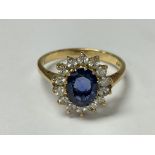 An 18ct gold sapphire and diamond ring. The approx