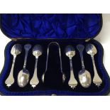 A cased hallmarked silver spoon and tongs set, the