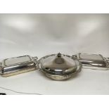 A pair of silver plated entree dishes and a silver
