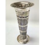 A hallmarked silver trumpet vase lined with blue g