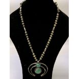 An unusual silver necklace and large pendant set w