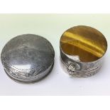 Two silver pill boxes, one set with tigers eye.