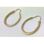 A pair of 9ct gold hoop earrings, weighing approxi