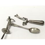 A silver cigarette holder with a silver chain and